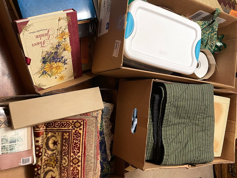 (4) Boxes of Rugs and Doilies