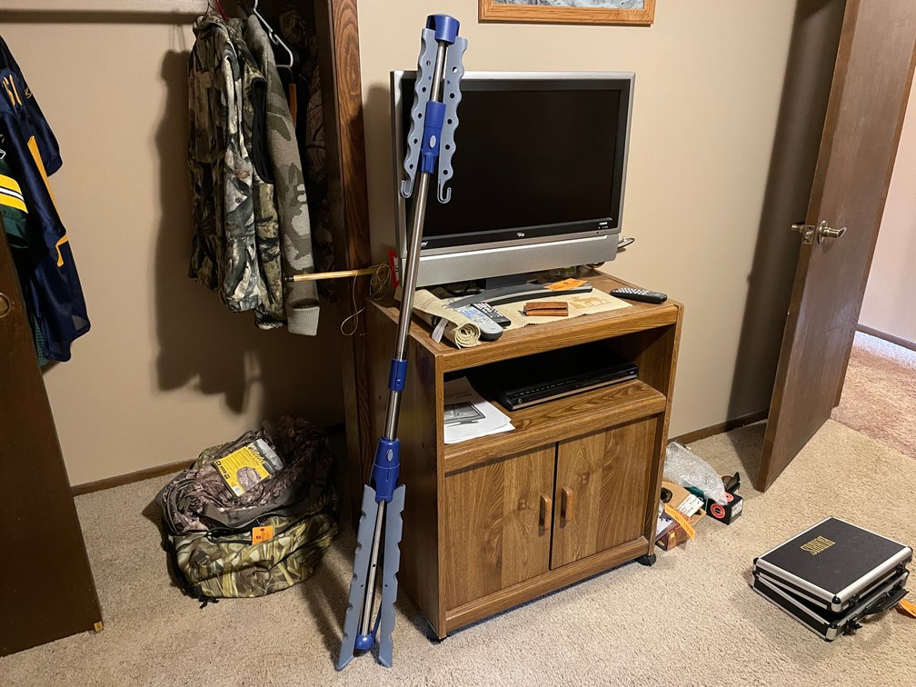Clothes Rack, TV, and Wooden Shelf