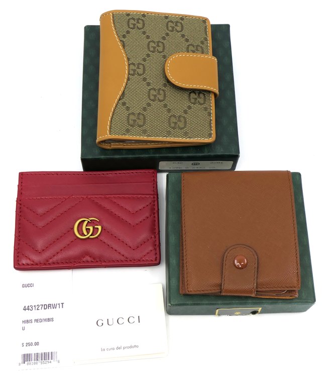 Three Gucci Wallets