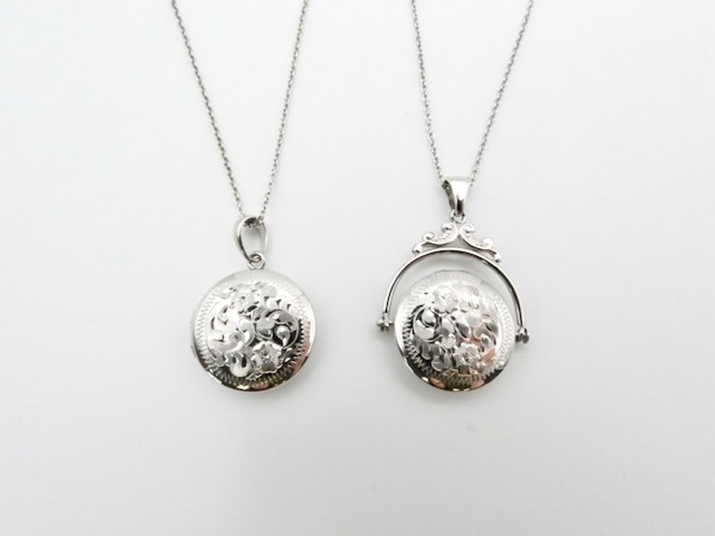 Two Sterling Silver Engraved Lockets
