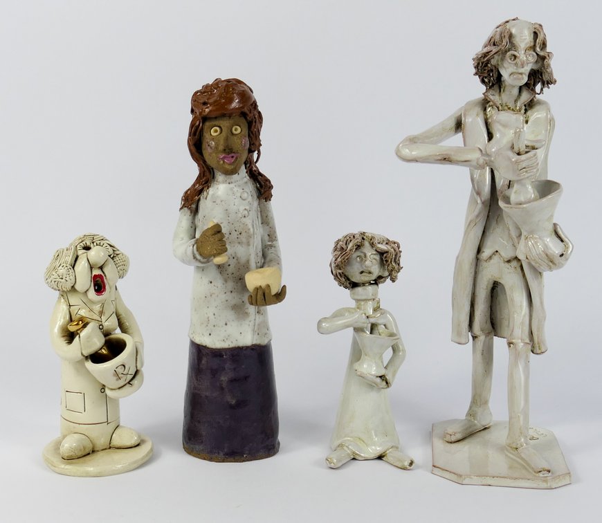 Four Pottery Pharmacist Statuettes