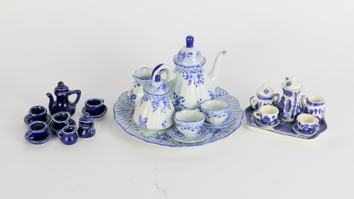 Three Miniature Ceramic Tea Sets with Blue Details