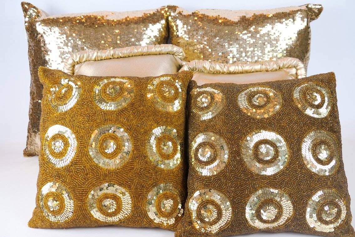 Six Gold Tone Pillows