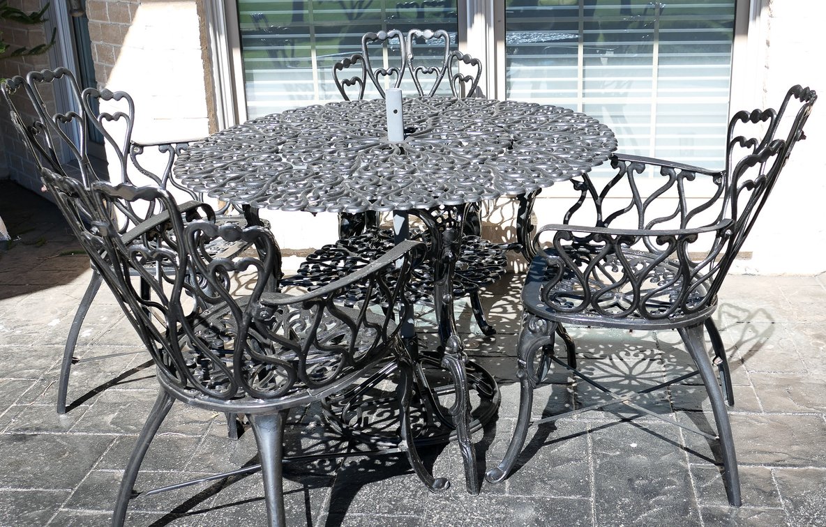 Ornate Cast Metal Patio Table and Four Chairs