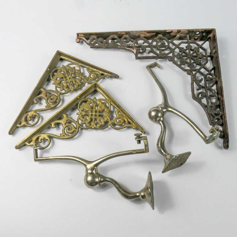 Two Metal Shelf Supports and Three Cast Metal Brackets