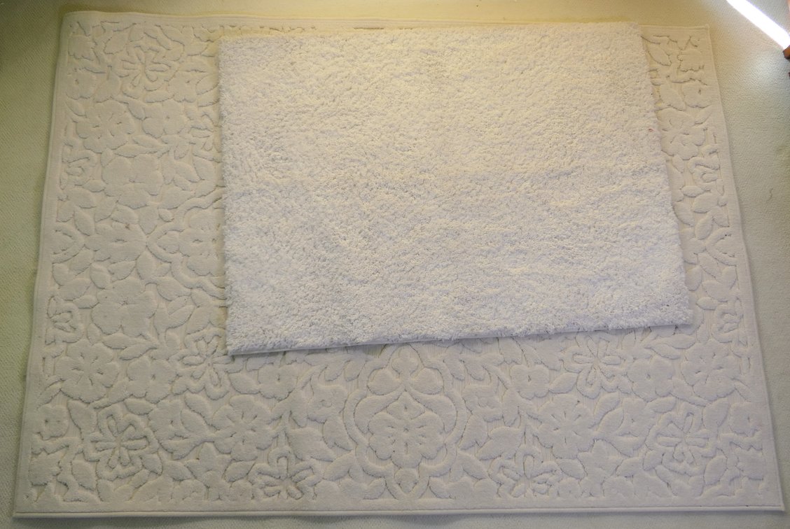 Two Cream Colored Rugs
