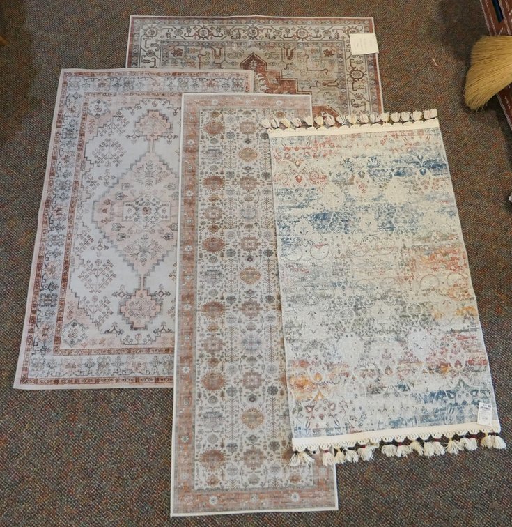Four Soft Colored Accent Rugs
