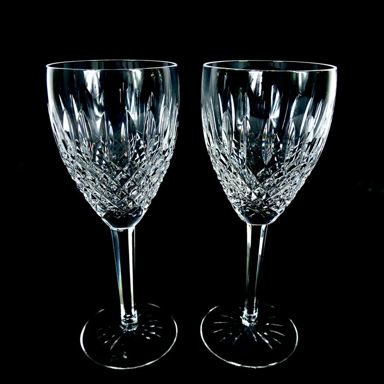 Two crystal goblets by Waterford in the Castlemaine pattern, featuring a geometric accent pattern. Marked on the bottoms Waterford.