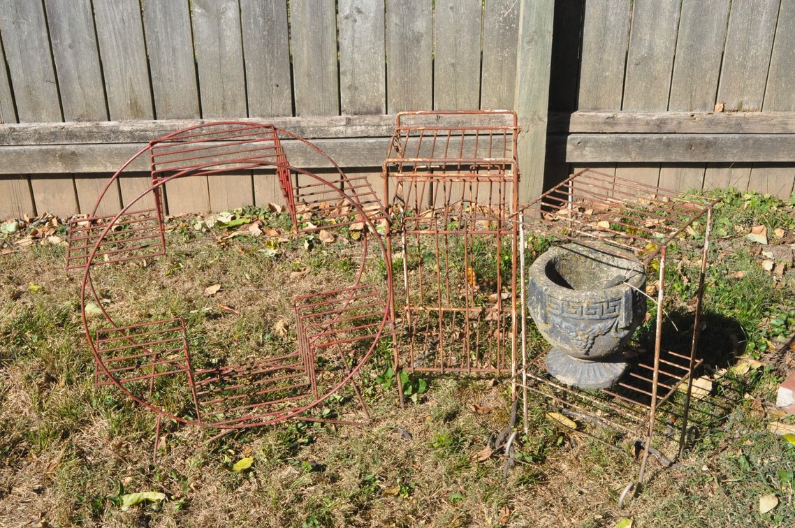 Three Metal Plant Stands and One Concrete Planter