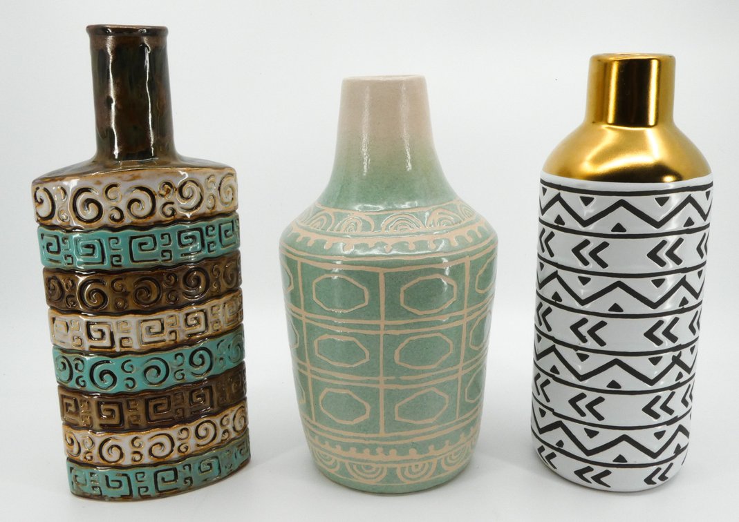 Three Pieces of Pottery Three pieces of pottery in the form of vases with geometric patterns.