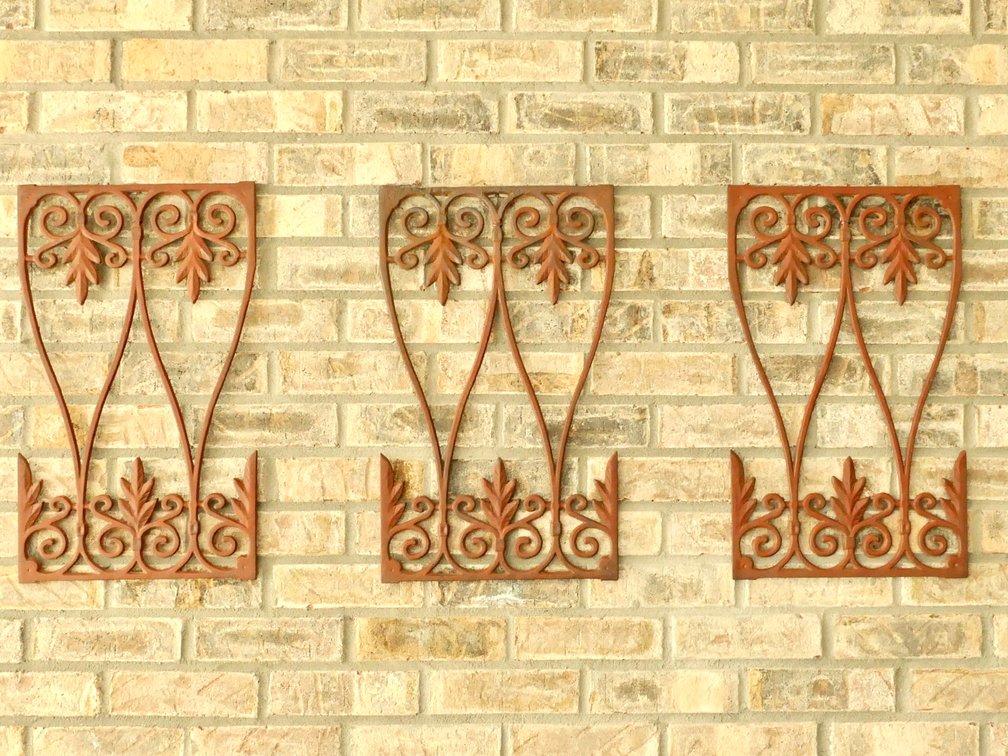 Three Cast Iron Decorative Wall Panels