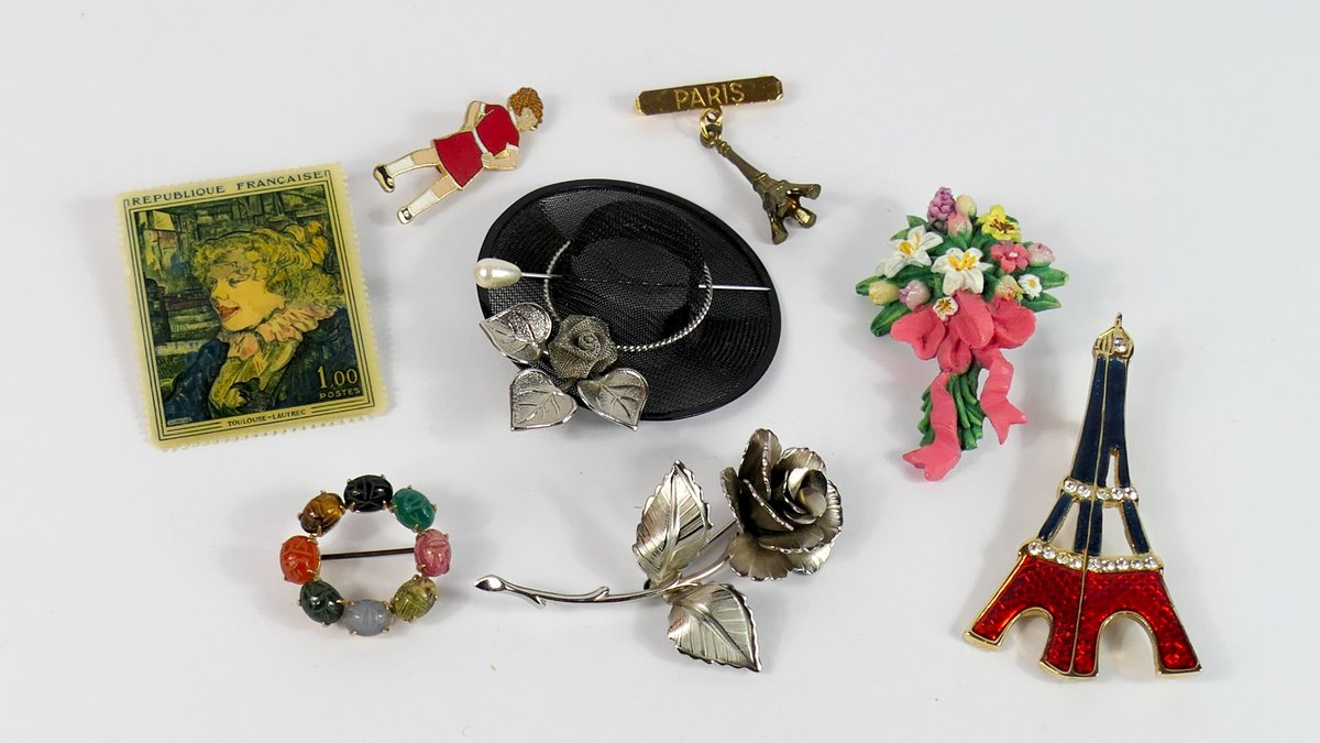 Eight Brooches