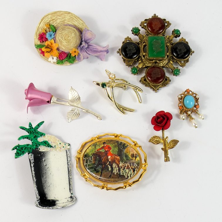 Eight Brooches and Pins
