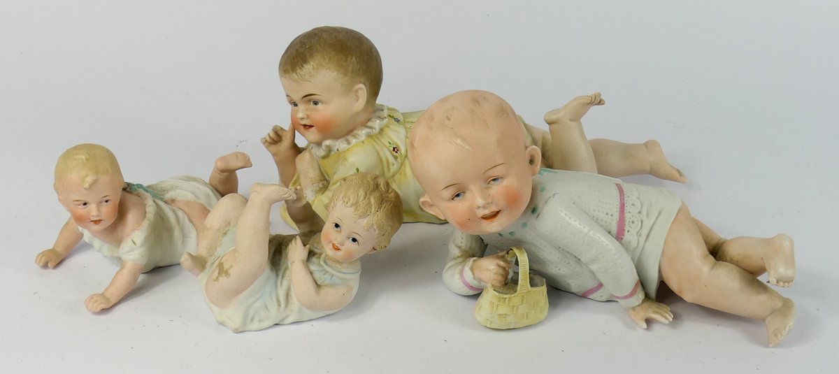 Collection of  Antique Porcelain Piano Baby Figurines