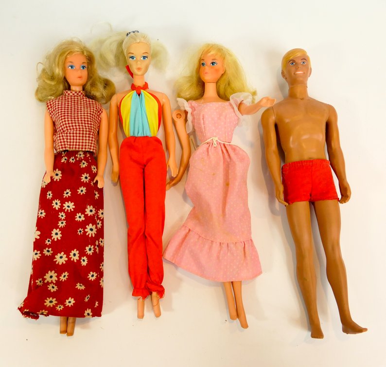Three Barbies and a Ken Doll