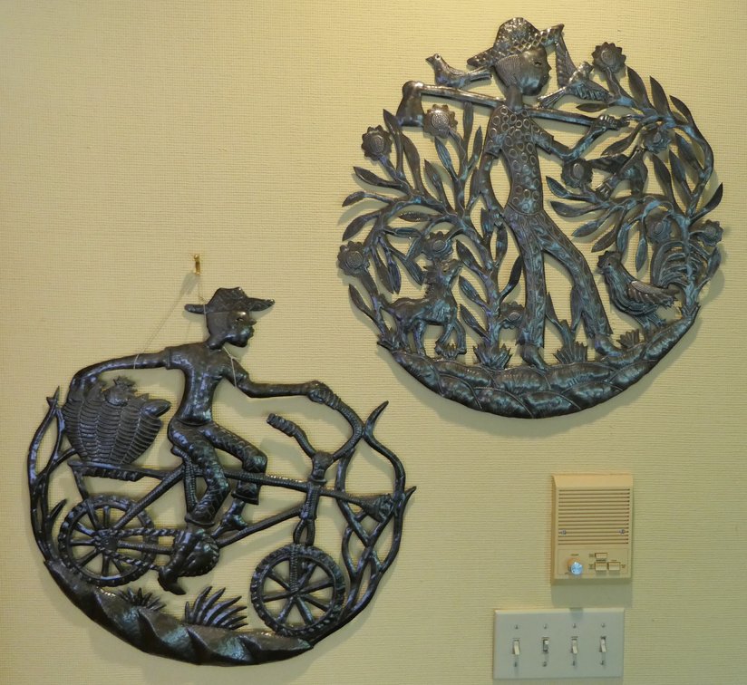 Two Round Metal Wall Hanging Figures