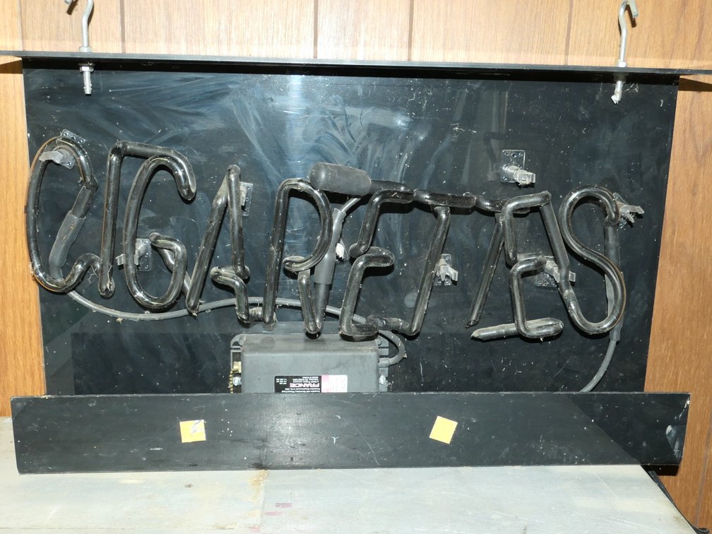 Black Neon 'Cigarettes' Sign for Repair