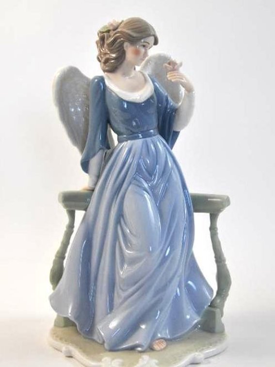 Porcelain Angel Holding Flower