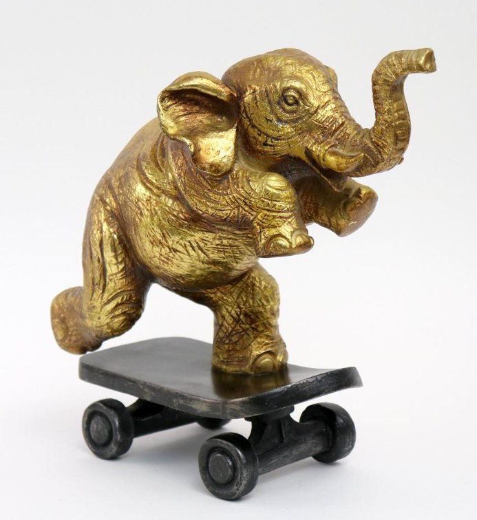 Elephant on Skateboard Figurine