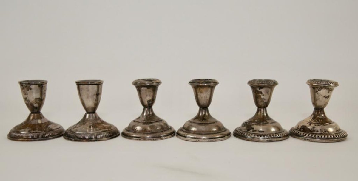 Three Pairs of Sterling Silver Weighted Candlesticks