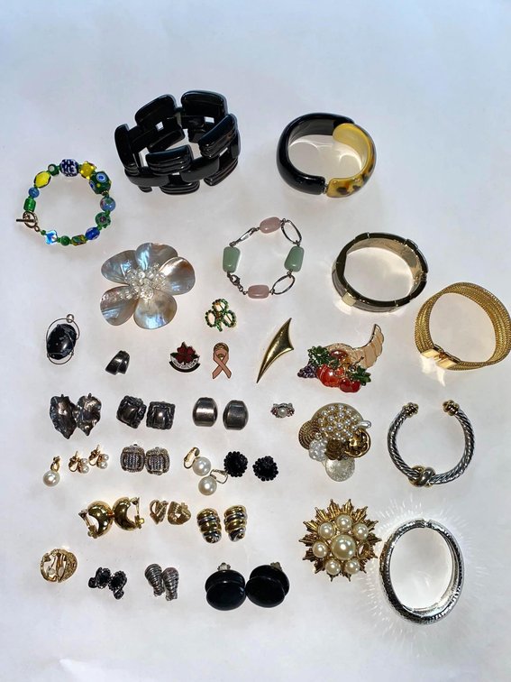 Collection of Jewelry Including Earrings, Bracelets, and Brooches