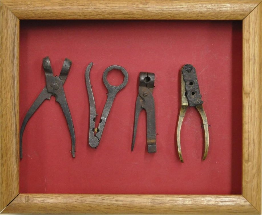 Display of 4 Antique 1 and 2 Cavity Bullet Molds