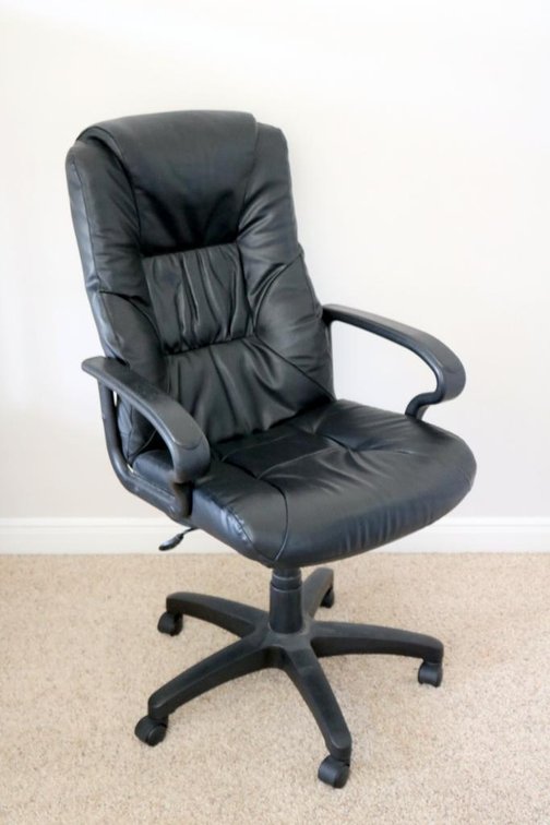 Black office chair on casters