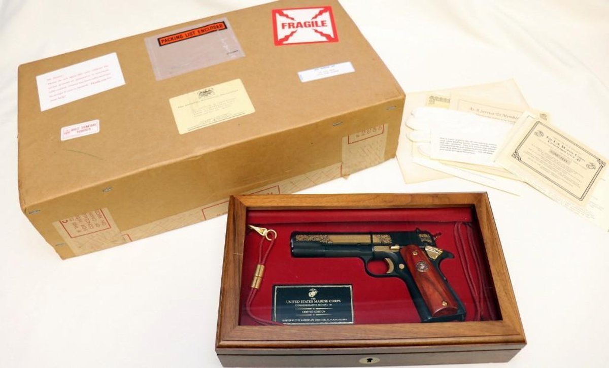 The U.S. Marines Corps Commemorative M1911A1 .45 cal pistol in display case