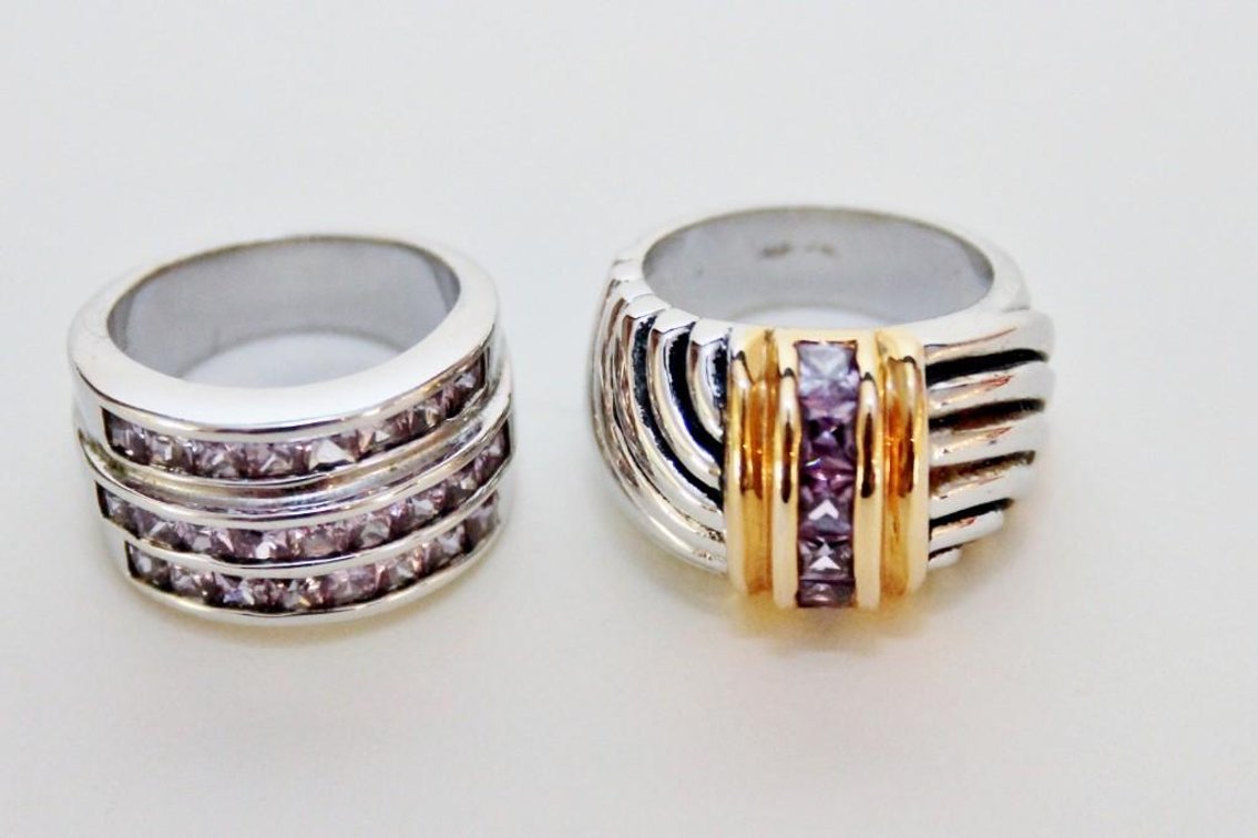 (2) Silver Tone Rings with Amethyst Colored Stones