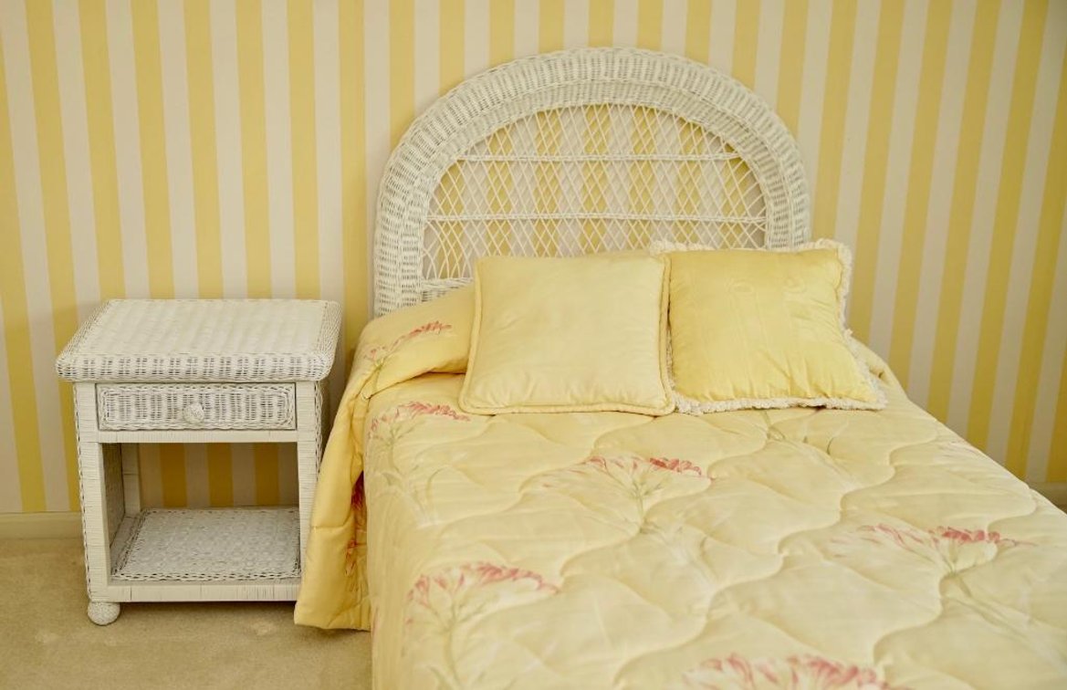 White Wicker Bed and Nightstand
