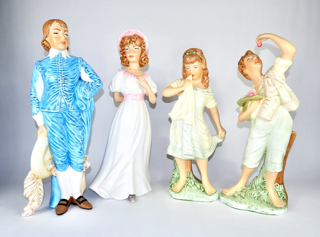 Four Hand Painted Porcelain Figures