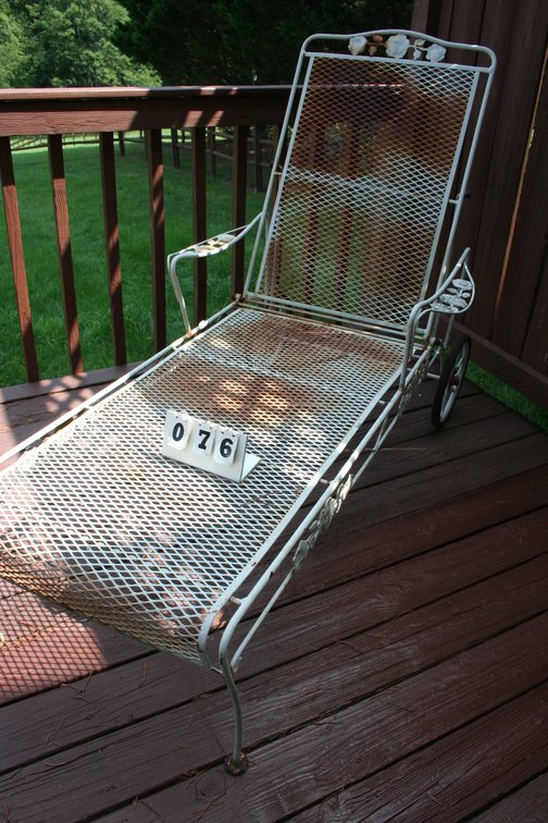 Image for White wrought iron lounge chair with rear wheels