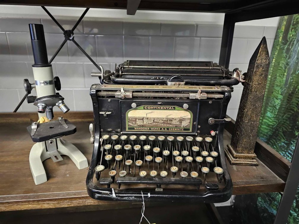 Antique Continental Typewriter, Egyptian Monolith Statue, and Microscope