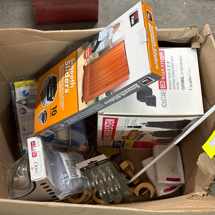 Assorted Household Supplies: Bed Riser, Furniture Sliders, Delta Showerhead, Glue Gun, Cabinet Pulls