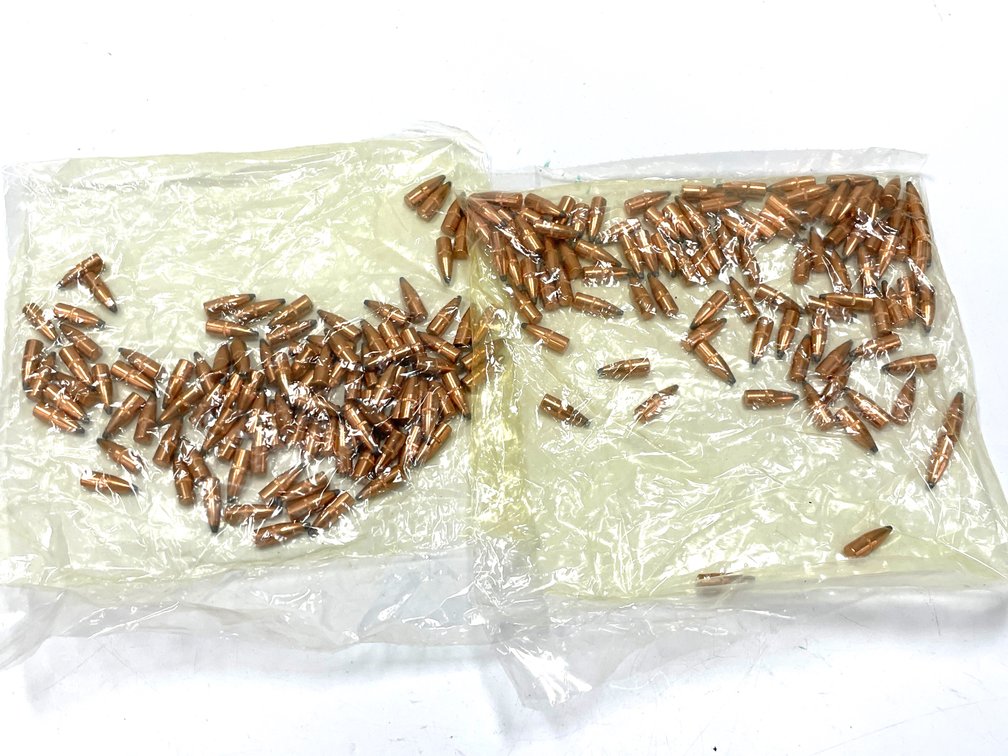 Two Bags of Copper-Jacketed Rifle Bullets