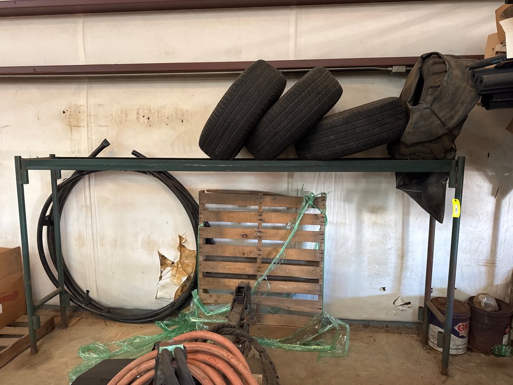 Tire Rack with Tires and Hose