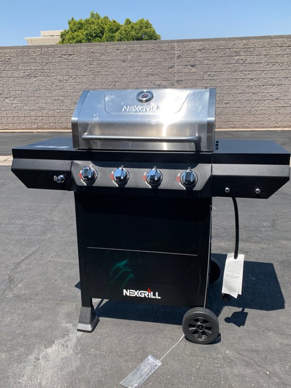 Nexgrill 4-Burner Propane Gas Grill in Black and Stainless Steel Main Lid - Never Used