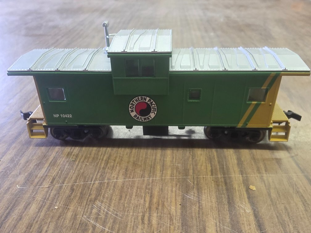 Atlas HO Scale 1918 Northern Pacific Extended Vision Caboose, model NP 10409.