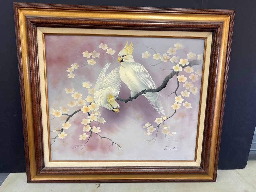 Two White Cockatoos Perched On A Blossoming Branch