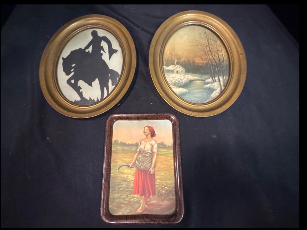 A silhouette of a rider and a winter landscape, alongside a rectangular tray depicting a woman with a sickle.