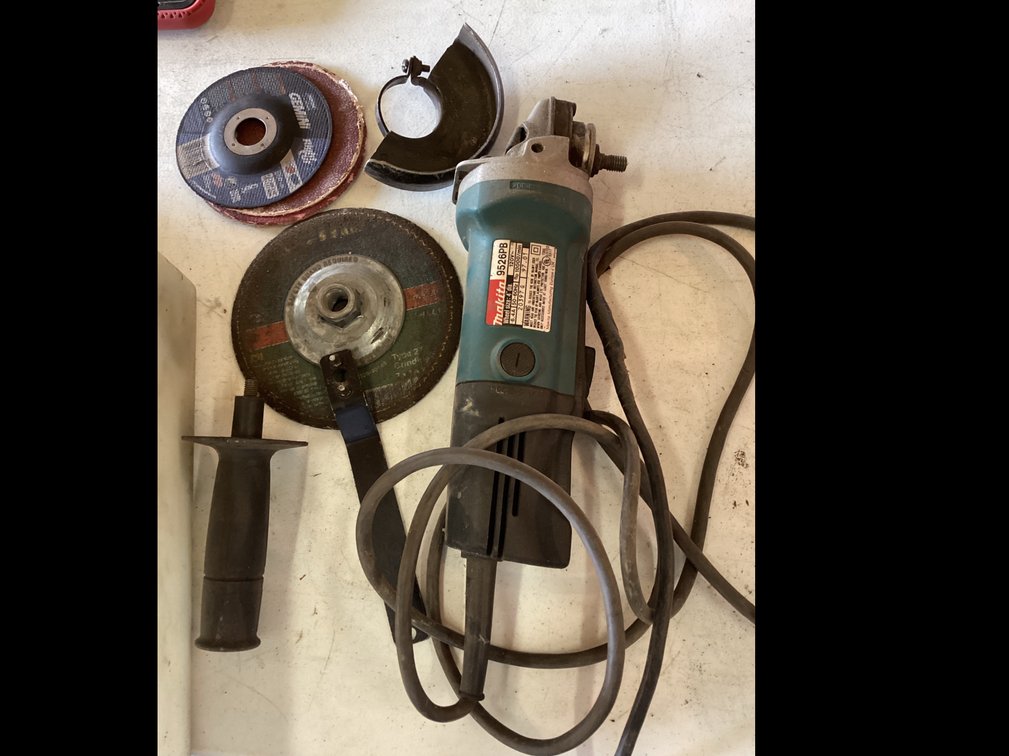 Makita 4” Grinder with Parts and Wheels