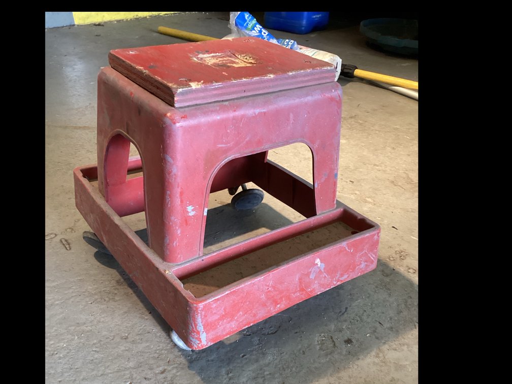 Red Plastic Roller Work Seat