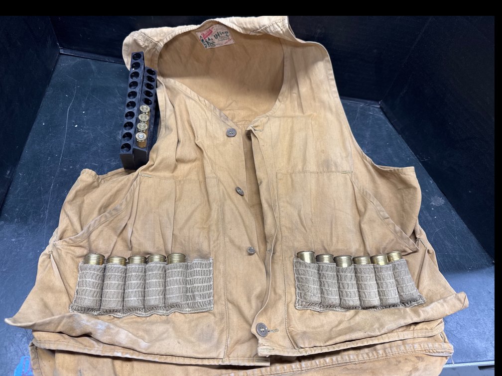 Hunting Ammo Vest W/ (12) 12GA Shotgun Shells and (4) 7mm Empty Shells
