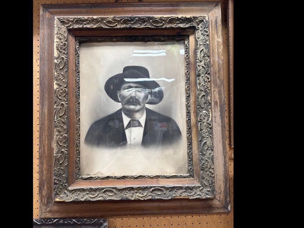 Historical Black & White Picture Of Man Wearing Wide Brimmed Cowboy Hat and Suit
