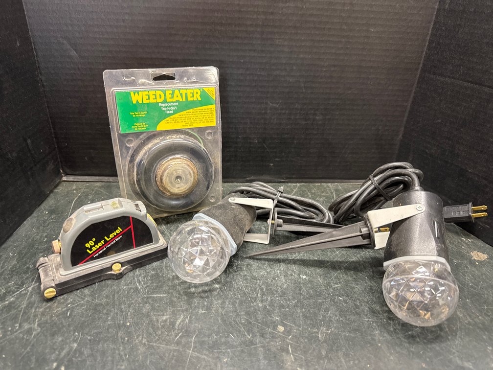 Laser Level, Weed Eater Replacement Head, and Two Electric Yard Lights
