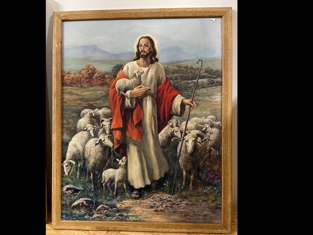 Jesus As The Good Shepherd Holding A Lamb