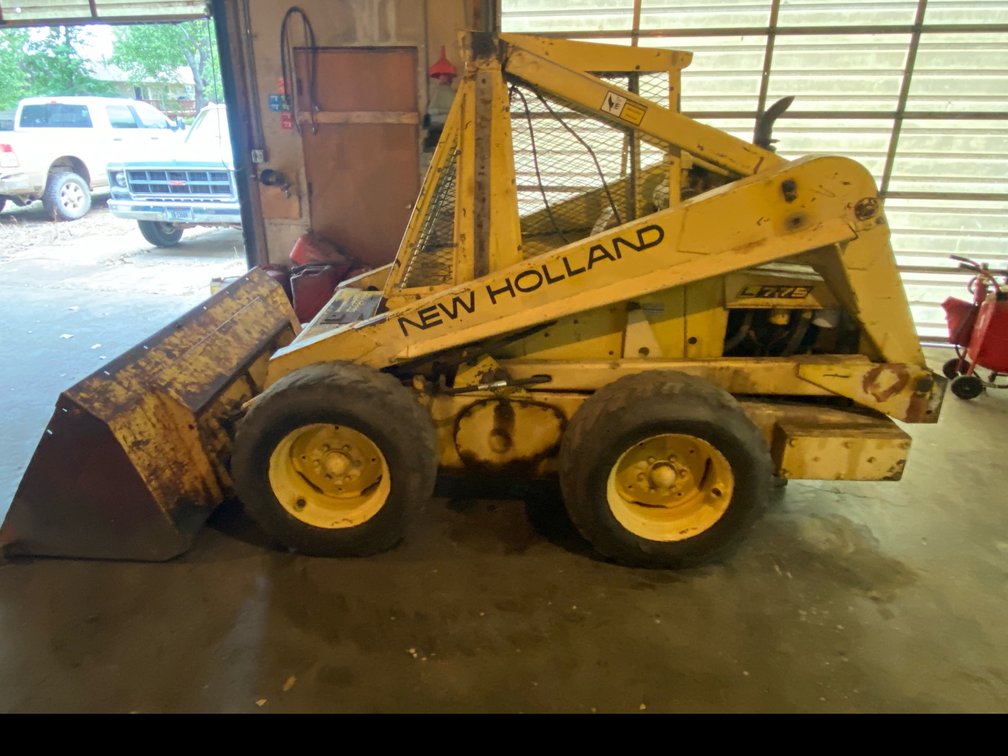 New Holland L775 Skid-Steer Loader and Back hoe