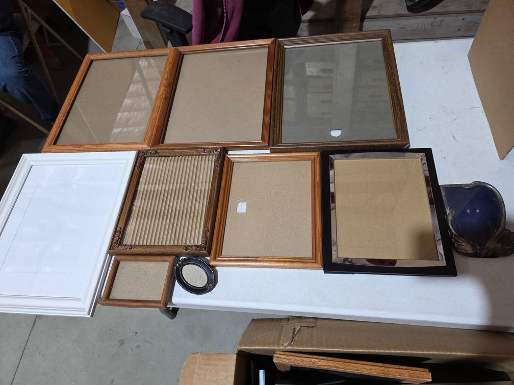 Assorted Picture Frames and Photo Album