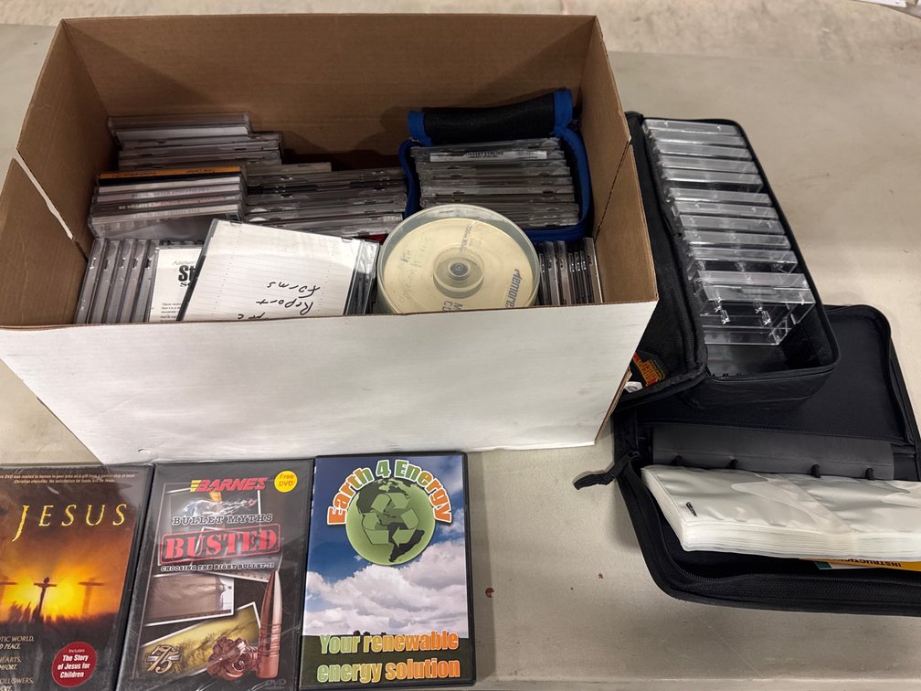 Assorted CDs, DVDs, and Storage Cases