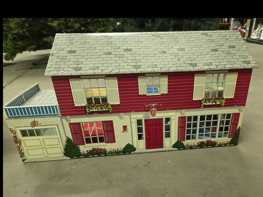 Marx tin litho two-story colonial-style dollhouse with an attached garage,